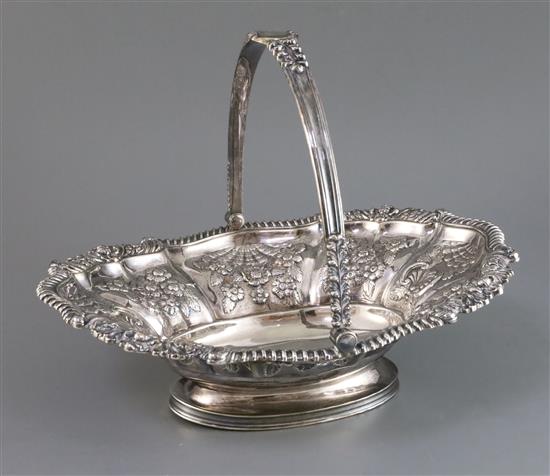 A George IV embossed silver swing-handled cake basket, James Kirby & Joseph Waterhouse, 37 oz.